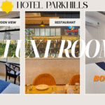 Luxurious deluxe room with king-size bed, modern furnishings, and ambient lighting